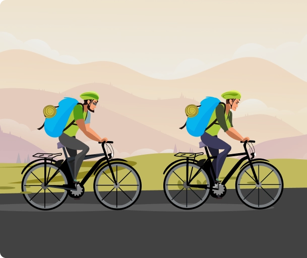 Two cyclists with backpacks riding bikes on a road with mountains in the background.